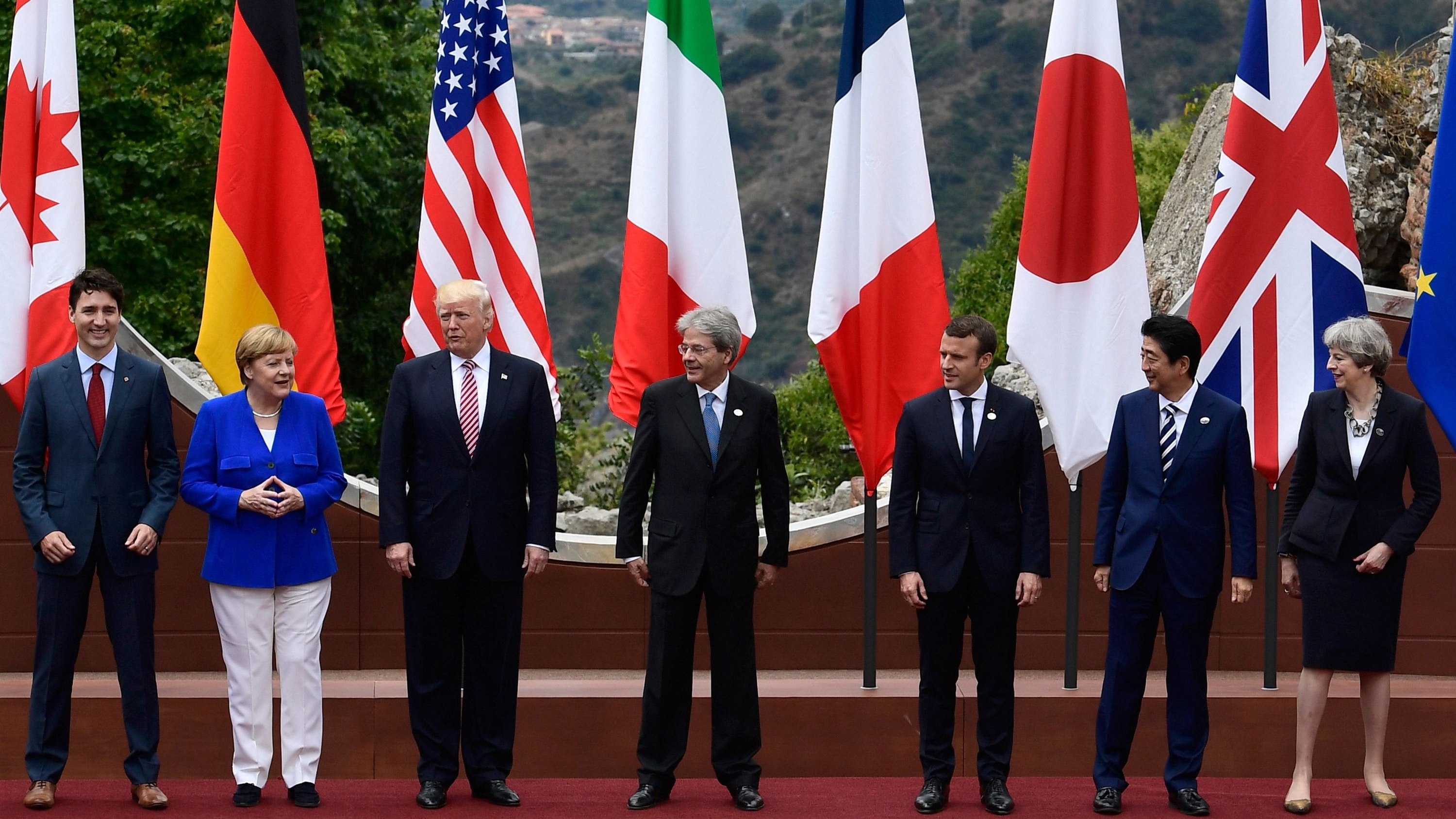 Canadian Prime Minister Justin Trudeau, German Chancellor Angela Merkel, US President Donald Trump, Italian Prime Minister Paolo Gentiloni, French President Emmanuel Macron, Japanese Prime Minister Shinzo Abe, and Britain's Prime Minister Theresa May at the G7 summit, held at the ancient Greek Theatre of Taormina, Sicily on May 26, 2017.
Image Souce: CNN
